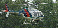 N36VA - Va. State Police  2001 Bell 407 in Danville Va. searching for a prisoner who walked off from a road workcrew. - by Richard T Davis