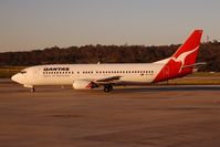 VH-TJR @ MEL - Taxiing to the runway in the warm glow of the evening sun - by Micha Lueck