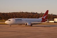 VH-TJR @ MEL - Taxiing to the runway in the warm glow of the evening sun - by Micha Lueck