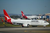 VH-VXE @ SYD - Taxiing to the gate - by Micha Lueck