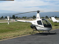 N7101J @ WVI - Specialized Helicopters (with their logo) 1999 Robinson R22 Beta @ Watsonville Municipal Airport, CA - by Steve Nation