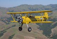 N54173 @ K3O7 - Stock Stearman N2S-3 flying wing above Hollister - by Tomas Bukowski
