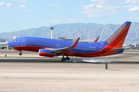 N237WN @ LAS - Southwest Airlines N237WN (FLT SWA1813) from Reno Tahoe Int'l (KRNO) touching down on RWY 25L.