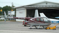 N7183N @ ISP - R44 Raven on the A&P ramp... - by Stephen Amiaga