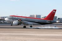 N327NB @ LAS - Northwest Airlines N327NB (FLT NWA1195) from Detroit Metro Wayne County (KDTW) touching down on RWY 25L. - by Dean Heald