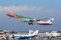 B-6055 @ LAX - China Eastern B-6055 Expo 2010 (FLT CES586) climbing out from RWY 25R enroute to Shanghai Pudong (ZSPD). The China Airlines Dreamliner B-18210 is parked at the Bradley International Terminal, seen below the departing B-6055. - by Dean Heald