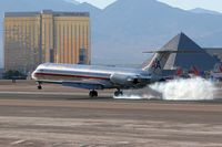 N463AA @ LAS - American Airlines N463AA touching down hard on the right main gear while landing on RWY 25L. - by Dean Heald