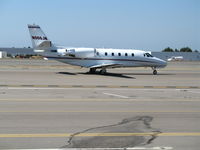 N966JM @ CRQ - Johnson Machinery 2001 Cessna 560XL taxying to exec terminal @ McClellan-Palomar Airport, CA - by Steve Nation
