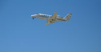N966JM @ CRQ - Johnson Machinery 2001 Cessna 560XL climbing out @ McClellan-Palomar Airport, CA - by Steve Nation