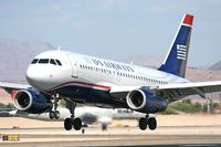 N831AW @ LAS - America West (US Airways) N831AW (FLT AWE51) from Fresno Yosemite Int'l (KFAT) near touchdown on RWY 25L. - by Dean Heald