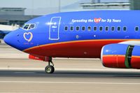 N238WN @ LAS - Close-up of Southwest Airlines N238WN 35th Anniversary - Spreading the LUV (FLT SWA2891) from Ontario Int'l (KONT) rolling out after landing on RWY 25L.