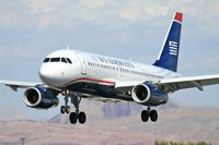 N818AW @ LAS - America West (US Airways) N818AW (FLT AWE575) from Dallas Ft Worth Int'l (KDFW) on short final to RWY 25L. - by Dean Heald