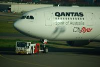 VH-EBD @ YSSY - Being towed to the gate - by Micha Lueck