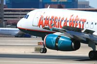 N820AW @ LAS - Close-up of America West N820AW landing on RWY 25L.