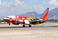 N214WN @ LAS - Southwest Airlines N214WN Maryland One touching down on RWY 25L.