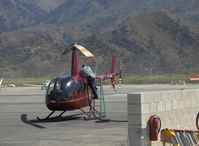 N435DE @ SZP - 2005 Robinson R44 RAVEN II, Lycoming IO-540 derated to 245 Hp for takeoff 205 Hp continuous, refueling - by Doug Robertson