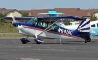 N841AC @ 26N - I wonder if the people living in the condos in the background are as much aviation enthusiasts as the owners of this sporty bird. - by Daniel L. Berek