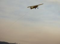 N3042M @ SZP - 1947 Piper PA-12 SUPER CRUISER, Lycoming O-360 180 Hp operated uncowled, banner tow pickup and immediate full power climb in mountains fire smoky skies - by Doug Robertson