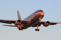 N332AA @ LAX - American Airlines N332AA (FLT AAL133) from John F Kennedy Int'l (KJFK) on final approach to RWY 24R late in the day. - by Dean Heald