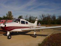 N2371W @ MEZ - Chris Hulen preflighting the airplane in Mena, AR, after repaint. - by Heather Hulen