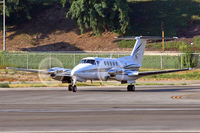 N427P @ LGB - Beechcraft King Air B200 holding short of RWY 30 prior to departure. - by Dean Heald