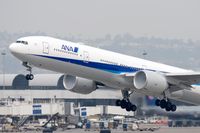 JA735A @ LAX - All Nippon Airways JA735A (FLT ANA5) - with condensation forming at the engine faces - departing RWY 25R enroute to Narita Int'l (RJAA).