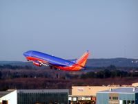 N327SW @ MHT - late afternoon take-off from runway 17/35 northbound direction - by John Newall