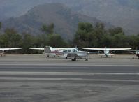 N1965Z @ SZP - 1965 Beech S35 BONANZA, Continental IO-520-B 285 Hp, taxi search for tiedown - by Doug Robertson