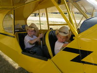 N49571 @ KOSH - Garrett and Trent Williams in the Cub at Oshkosh - by Steve Williams