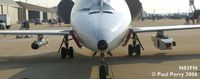N83FN @ NTU - Composite photo to showcase the stores: an ECM pod on the starboard, and a towed target on the port wing - by Paul Perry