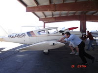 N6461P @ KGJT - Pushing A/C out of storage - by Lisa Cunningham