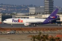 N313FE @ LAX - Fed Ex N313FE (FLT FDX3706) exitting RWY 25R after arrival from Indianapolis Int'l (KIND). [Canon 30D, Canon 300mm f/2.8L IS]