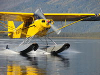 N78675 - PA-11 Cub Special on Edo 1400's  Walker Lake, AK  August 2006 - by Jeff Helmericks