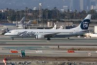 N318AS @ LAX - Alaska Airlines N318AS (FLT ASA279) taxiing to the remote terminal after arrival from Los Cabos Int'l (MMSD).
