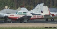 N9304M @ PVG - Well worn Mooney, with her curtains drawn