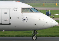 D-ACRK @ EGCC - Waving German CRJ F/O - by Kevin Murphy