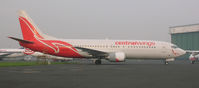 SP-LLI @ EPWA - Boeing 737-400 on maintenance ramp - by John J. Boling