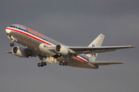 N332AA @ LAX - American Airlines N332AA (FLT AAL22) climbing out from RWY 25R enroute to John F Kennedy Int'l (KJFK). - by Dean Heald