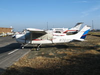N7610X @ PAO - Chalk Hills Consulting 1977 Cessna R182 with new rudder colors @ Palo Alto Airport, CA - by Steve Nation