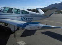 N541DB @ SZP - 1964 Beech S35 BONANZA, Continental IO-520-B 285 Hp, wingtip strobe, nav light, gear status mirror and light shield wing fence - by Doug Robertson