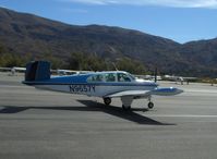 N9657Y @ SZP - 1962 Beech P35 BONANZA, Continental IO-470-N 260 Hp, tri-blade prop, tip tanks, taxi after landing - by Doug Robertson