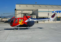 N154EH @ OAK - Red Bull 1985 MBB BO-105S photo ship for Fleet Week Red Bull air race @ Oakland International Airport, CA - by Steve Nation