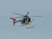 N911WY @ VGT - LVMPD / 2000 Md Helicopter Inc 369FF / Did you notice the Vision Airlines behind the skids? Cool huh! I wish it were a better photo. - by Brad Campbell