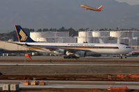 9V-SGB @ LAX - Singapore Airlines 9V-SGB taxiing to the Tom Bradley International Terminal  after arrival on the north complex. Southwest FLT 2658 climbing out from RWY 24L enroute to Nashville can be seen in the background.