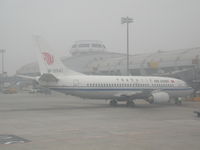 B-2581 @ PEK - A foggy day at Beijing Capital International Airport (PEK) China - by Ken Wang