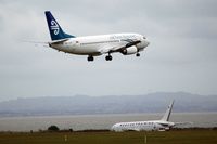 ZK-SJE @ AKL - On finals, passing the emergency training aircraft body... - by Micha Lueck