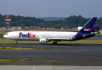 N609FE @ RJAA - MD11