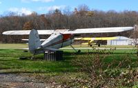 N2205V @ 12N - Final perch for a classic bird? This 1948 Cessna 140 has seen better days. - by Daniel L. Berek