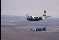 N711YY - Aero Commander 520 and T-6 going to an airshow