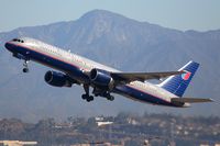 N590UA @ LAX - United Airlines N590UA (FLT UAL106) climbing out from RWY 25R enroute to Chicago Ohare Int'l(KORD) with Strawberry Peak in the background.